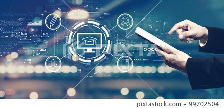 E-learning concept with businessman using a tablet 99702504