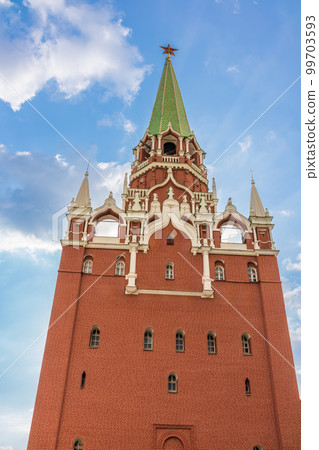 Troitskaya tower of Moscow Kremlin on a blue sky background in sunny summer day 99703593