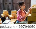 Asian teenager owner business woman work at home for online shopping and sale. 99704060