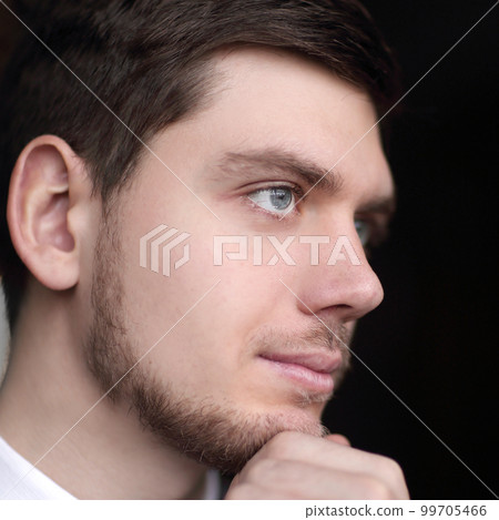 close up.portrait of a beautiful businessman on a dark background 99705466