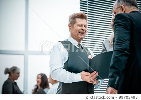 close up. the working group discussing business document 99705498