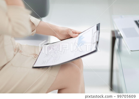 close up. business woman checking financial documents. close up. business woman checking financial documents. 99705609