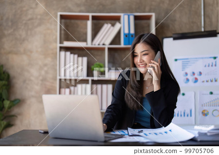 business woman talking smartphone with accountant consult and for calculating tax, financial report, Working with a business graph document report business woman talking smartphone with accountant consult and for calculating tax, financial report, Working with a business graph document report 99705706