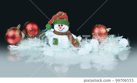 Toy snowman with festive red balls. black background 99706555