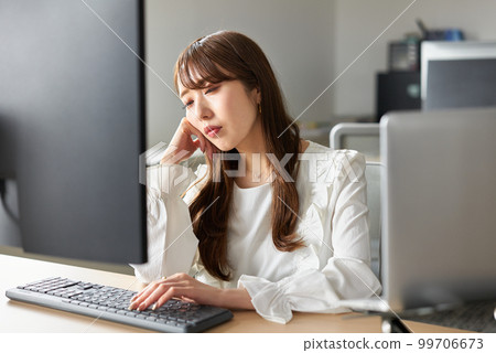 woman tired from work 99706673