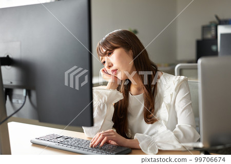 woman tired from work 99706674