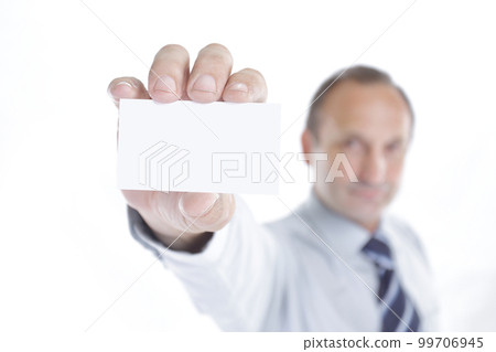 blurred image. businessman showing a blank business card blurred image. businessman showing a blank business card 99706945