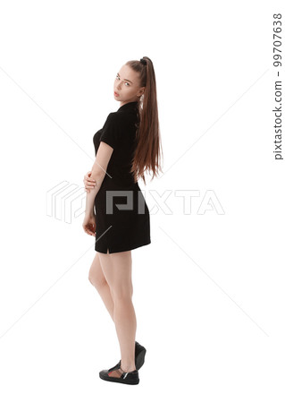 rear view.beautiful woman model in short black dress .isolated on white 99707638
