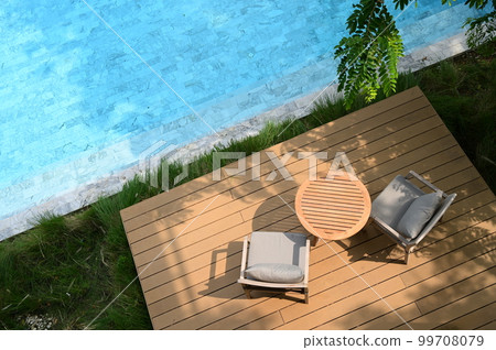 chair and deck on veranda, pool view 99708079
