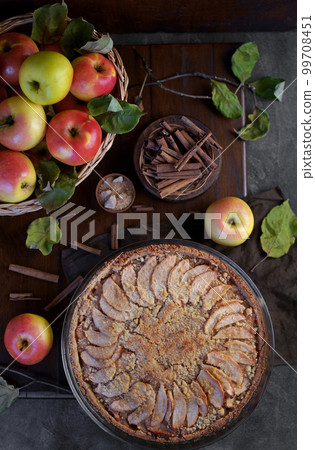 apple pie with fresh fruits on a wooden table apple pie with fresh fruits on a wooden table 99708451