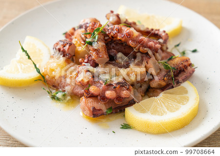 grilled octopus or squid with butter lemon sauce grilled octopus or squid with butter lemon sauce 99708664
