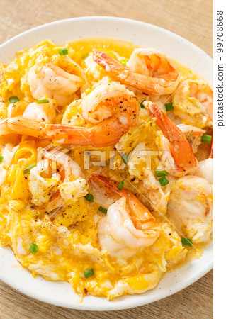 creamy omelet with shrimps or scrambled eggs and shrimps 99708668