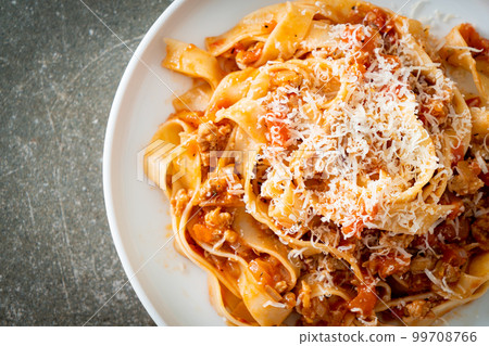 Homemade pasta fettuccine bolognese with cheese 99708766