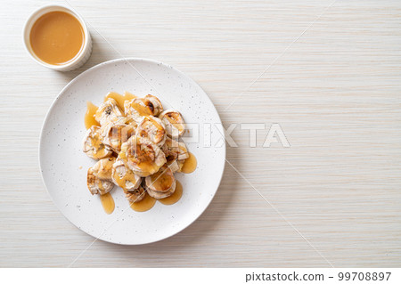 Grills Banana with Caramel Sauce Grills Banana with Caramel Sauce 99708897