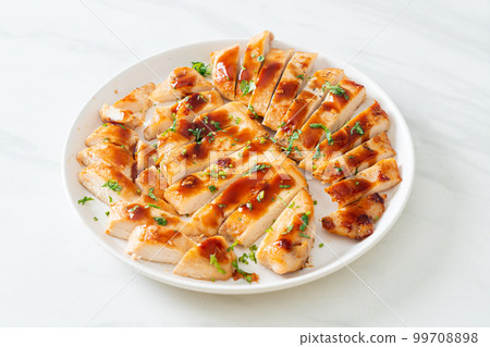 grilled chicken breast sliced on plate grilled chicken breast sliced on plate 99708898