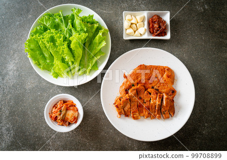 grilled pork marinated Kochujang sauce in Korean style with vegetable and kimchi 99708899