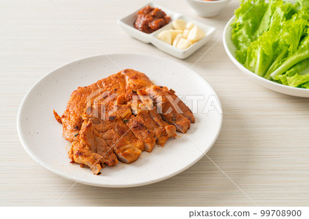 grilled pork marinated Kochujang sauce in Korean style with vegetable and kimchi grilled pork marinated Kochujang sauce in Korean style with vegetable and kimchi 99708900