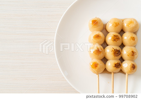 Mitarashi dango. Dumpling in a sweet soy sauce Mitarashi dango. Dumpling in a sweet soy sauce 99708902