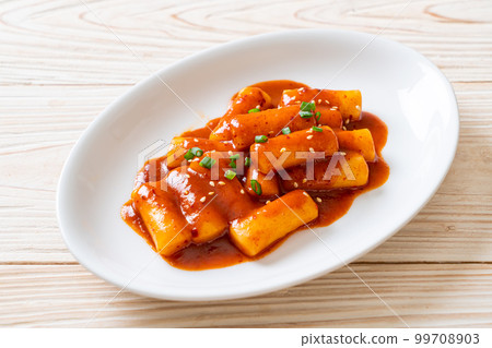 Korean rice cake stick in spicy sauce - Tteokbokki Korean rice cake stick in spicy sauce - Tteokbokki 99708903