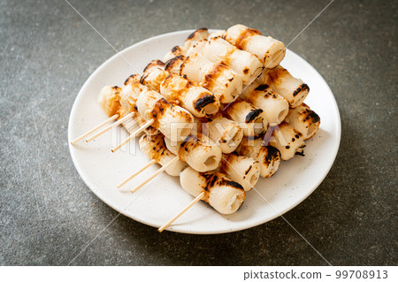 grilled tube shaped fish paste cake skewe or tube squid skewer 99708913
