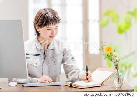 Young engineer working in an open office 99708960