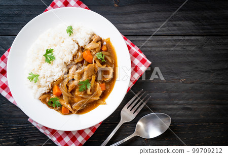 Japanese curry rice with sliced pork, carrot and onions Japanese curry rice with sliced pork, carrot and onions 99709212