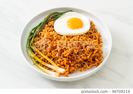 dried Korean spicy instant noodles with fried egg dried Korean spicy instant noodles with fried egg 99709219