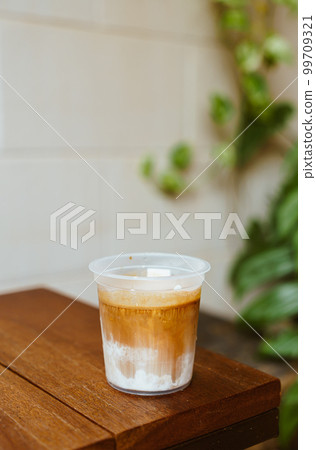 dirty coffee in takeaway glass 99709321