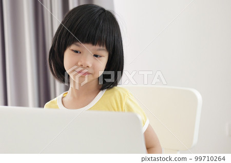 little asian girl student study online using laptop computer at home little asian girl student study online using laptop computer at home 99710264