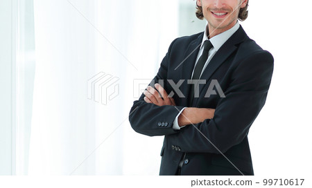 confident business man on background of office. confident business man on background of office. 99710617