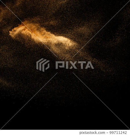 Sand explosion isolated on black background. Freeze motion of sandy dust splash.Sand texture concept. Sand explosion isolated on black background. Freeze motion of sandy dust splash.Sand texture concept. 99711242
