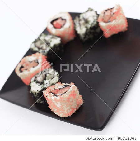 set of Sushi rolls on black plate set of Sushi rolls on black plate 99712365