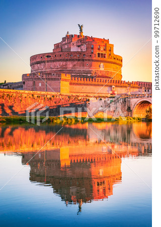 Rome, Italy. Castel Sant'Angelo water reflection in Tiber River, sunrise landscape. 99712690