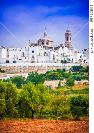 Locorotondo, Italy. Charming whitwashed city in Puglia, historical Apulia. Locorotondo, Italy. Charming whitwashed city in Puglia, historical Apulia. 99712691