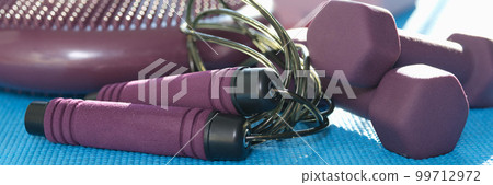 Room with equipment for home workouts and fitness 99712972