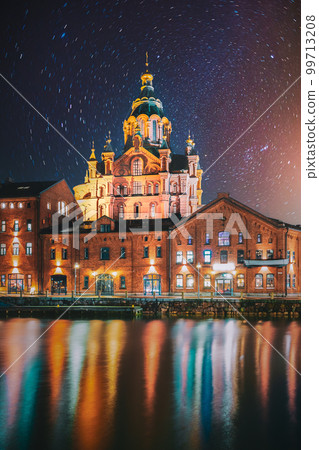 Helsinki, Finland. Bright Starry Rotation Sky. View Of Kanavaranta Street With Uspenski Cathedral In Evening Night Illuminations. Stars Movement Lines 99713208