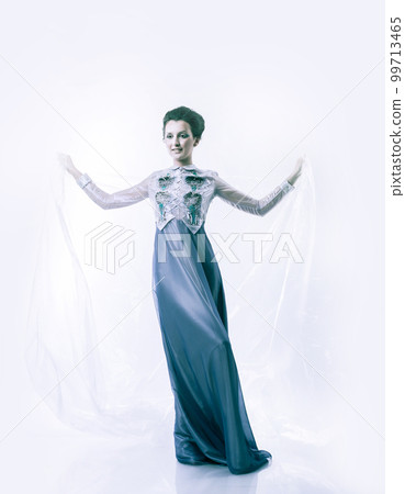 in full growth. beautiful woman model posing in a fashionable evening dress. in full growth. beautiful woman model posing in a fashionable evening dress. 99713465