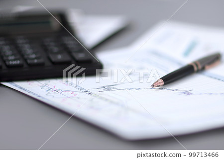 close up.pen, financial chart and calculator on the businessman's Desk close up.pen, financial chart and calculator on the businessman's Desk 99713466