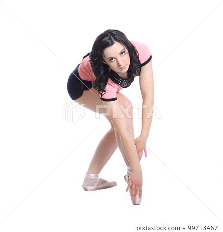 Beautiful ballerina posing in a white studio. Ballet dancer on white background Beautiful ballerina posing in a white studio. Ballet dancer on white background 99713467