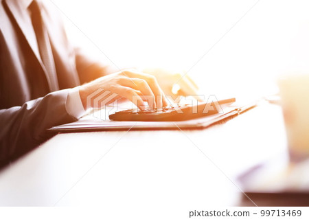 close up. businessman can use the calculator to calculate profit close up. businessman can use the calculator to calculate profit 99713469