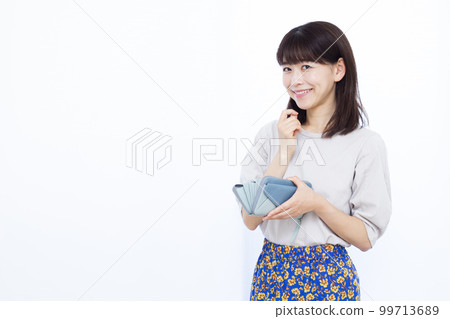 A woman in her thirties with a wallet A woman in her thirties with a wallet 99713689