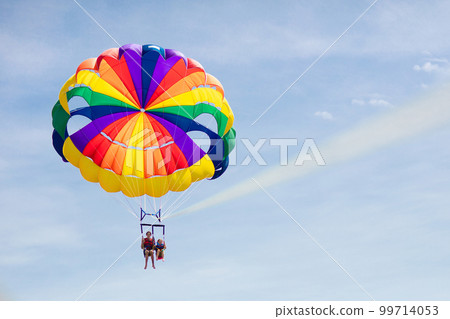 Kids parasailing. Water sport on summer vacation. 99714053