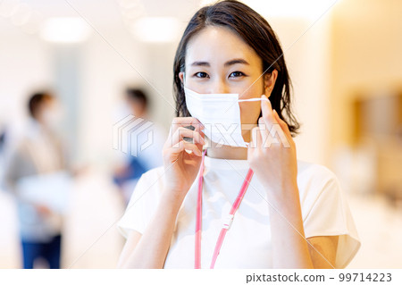 Woman wearing a mask in the office Shooting cooperation: LINK FOREST Woman wearing a mask in the office Shooting cooperation: LINK FOREST 99714223