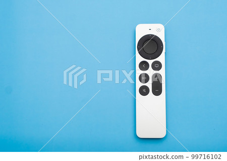 Siri Apple Tv 4k Remote controller on the blue background with copy space, February 2023, Prague, Czech Republic Siri Apple Tv 4k Remote controller on the blue background with copy space, February 2023, Prague, Czech Republic 99716102