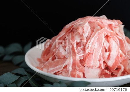 Piles of pork belly slices black background Piles of pork belly slices black background 99716176