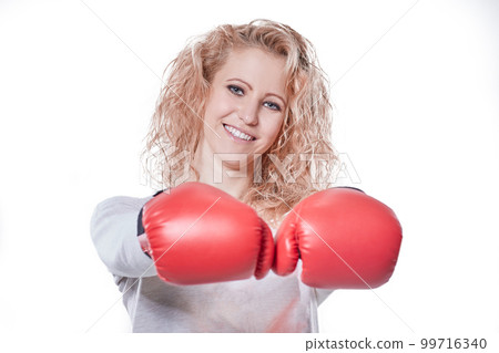 smiling young woman in Boxing gloves .isolated on white 99716340