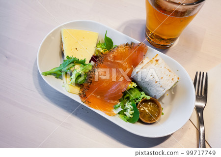 Salmon fillet, cheese and salad Salmon fillet, cheese and salad 99717749