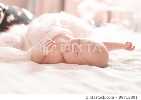 cute newborn baby is sleeping in the nursery. 99718891