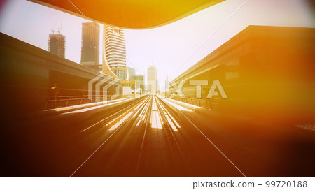 Dubai, Uae, United Arab Emirates Subway Train Ride Among Modern Skyscrapers In Dubai. Monorail During Sunset. Amazing Scenic View Bright Sunbeams 99720188