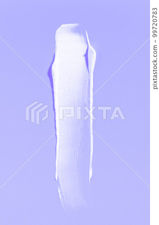 White cream smear on a purple background. Vertical macro photography. White cream smear on a purple background. Vertical macro photography. 99720783